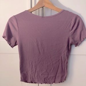 Tight fitting purple shirt